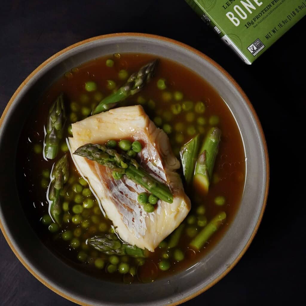 Spring Brodo with Cod, Asparagus, and Peas